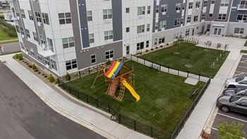 An aerial view of a playground in the middle of an apartment building